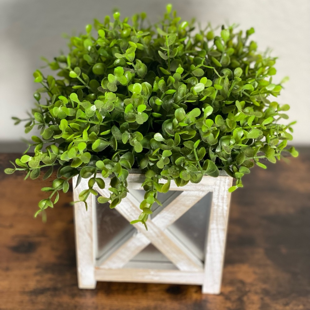 Faux plant in white and silver farmhouse style planter.